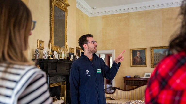 Visitors on a guided tour with National Trust staff at Springhill, County Londonderry